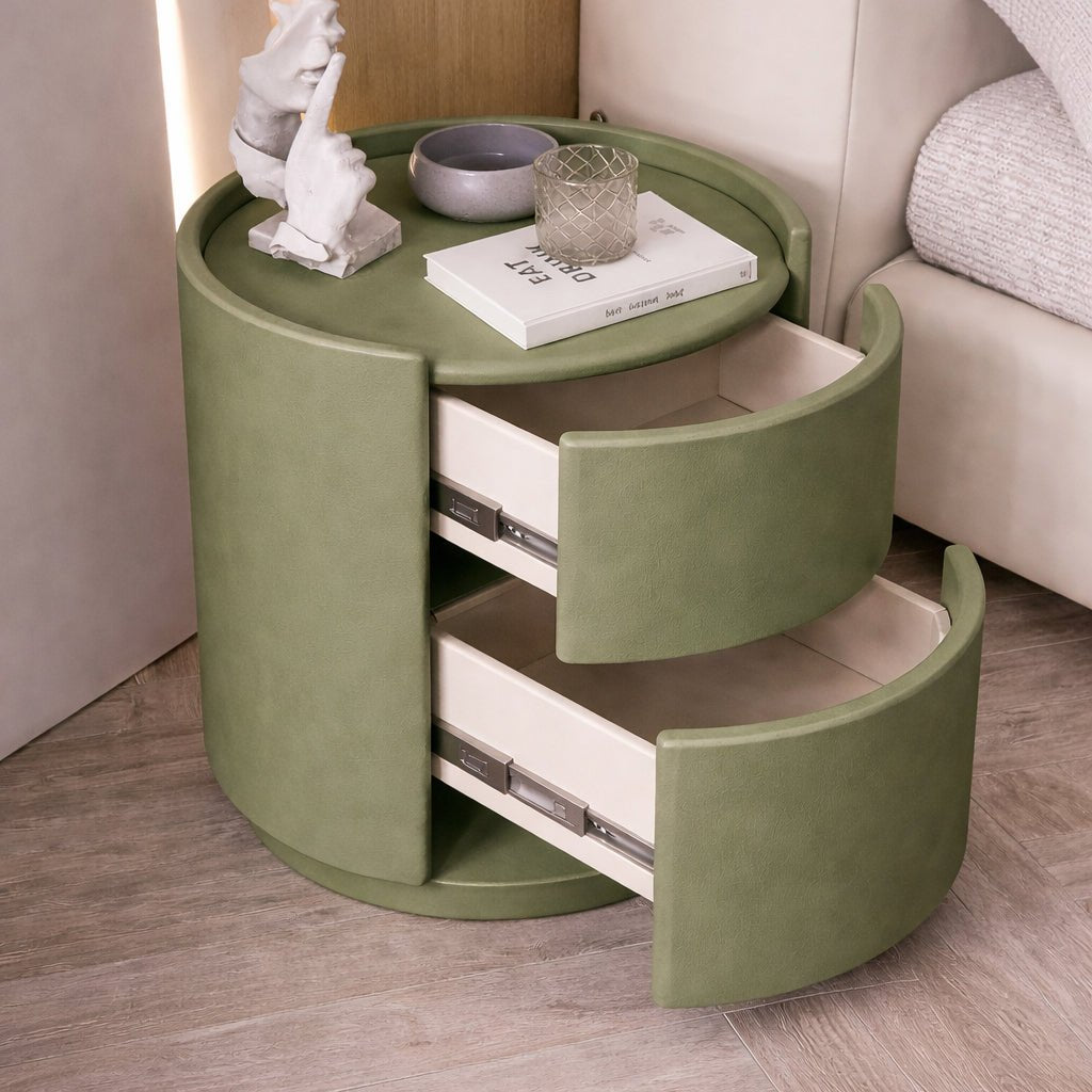 Green round side table with drawers in a room setting