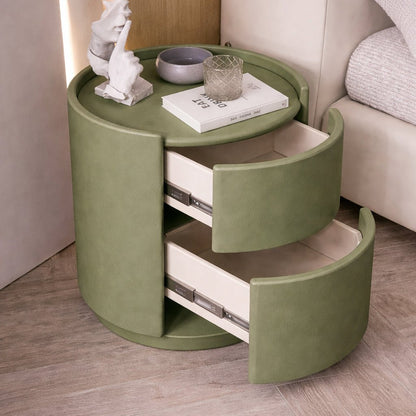 Green round side table with drawers in a room setting