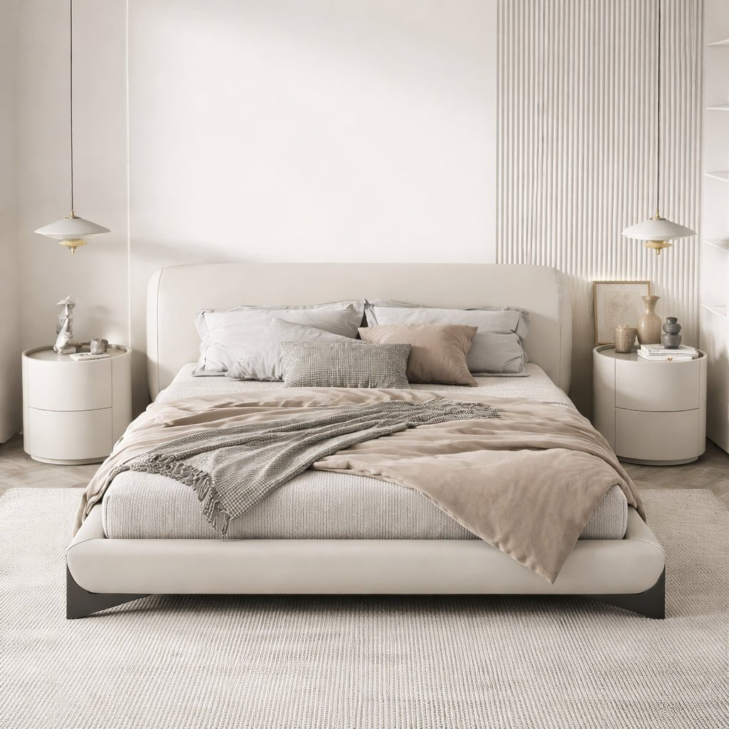 Modern bedroom with a beige bed and matching nightstands.