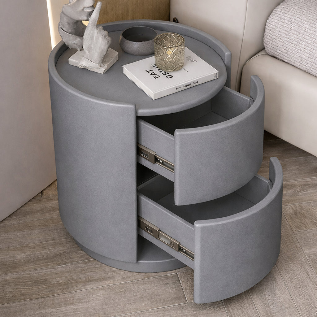 Gray round side table with drawers in a living room setting