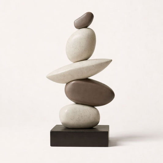 Stack of balanced stones on a white background