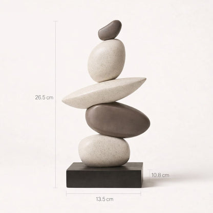 Stack of balanced stones on a white background with measurements indicated