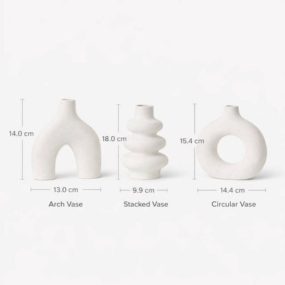 Three white vases with measurements on a light gray background