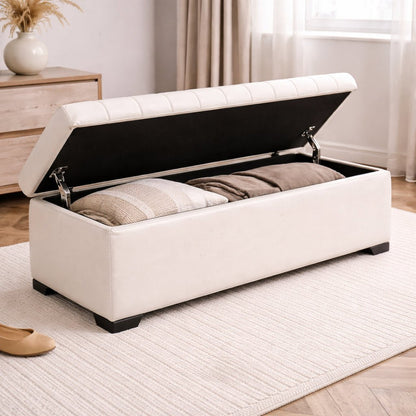 White storage bench with open lid revealing striped cushions in a room setting.